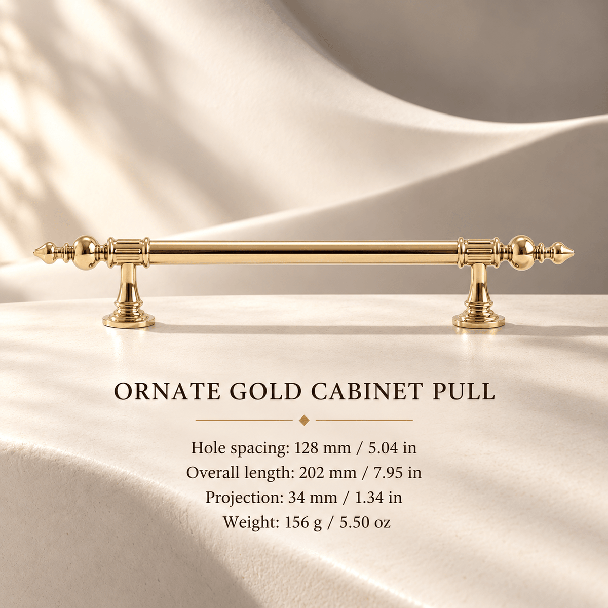 Ornate gold cabinet pull in ivory studio. Hole spacing: 128 mm / 5.04 in; Overall length: 202 mm / 7.95 in; Projection: 34 mm / 1.34 in; Weight: 156 g / 5.50 oz.