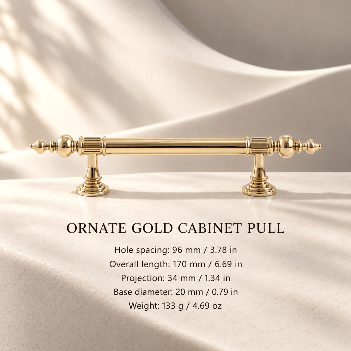 Ornate gold cabinet pull in ivory studio. Hole spacing: 96 mm / 3.78 in; Overall length: 170 mm / 6.69 in; Projection: 34 mm / 1.34 in; Base diameter: 20 mm / 0.79 in; Weight: 133 g / 4.69 oz.