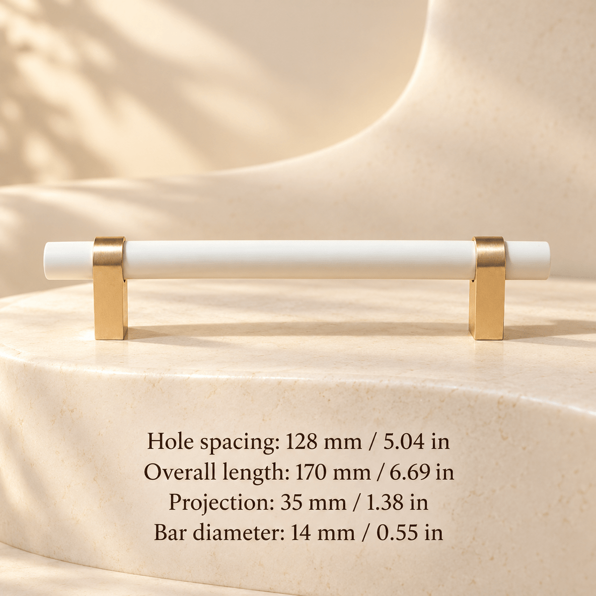 White painted wood pull with gold feet; Hole spacing: 128 mm / 5.04 in; Overall length: 170 mm / 6.69 in; Projection: 35 mm / 1.38 in; Bar diameter: 14 mm / 0.55 in on ivory stone studio background