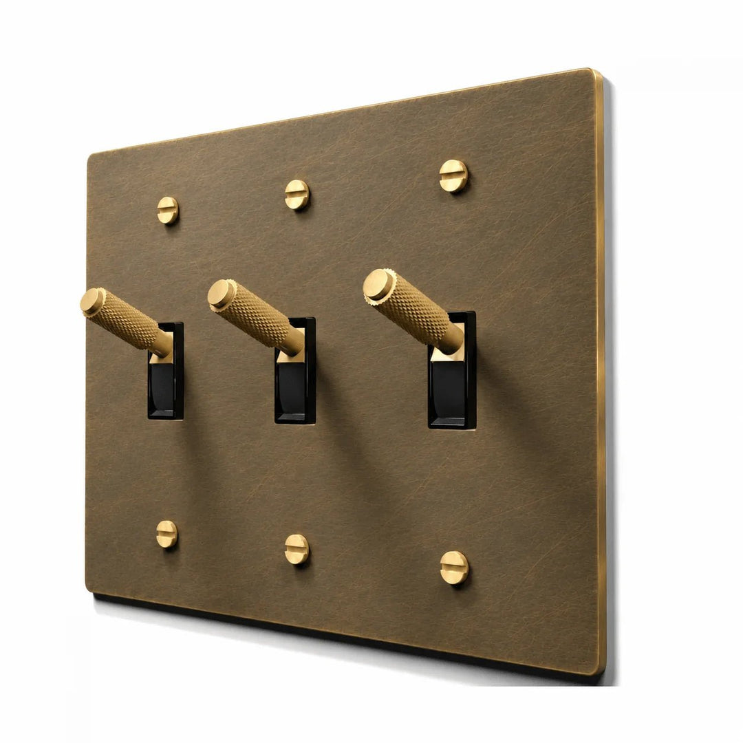 3 gang hand brushed aged brass toggle switch