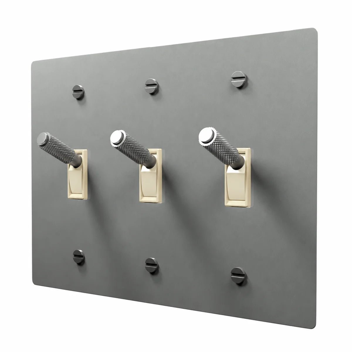 PlatePrestige Brass Toggle Switch 3-Gang in Stainless Steel with ivory toggle frames, angled view