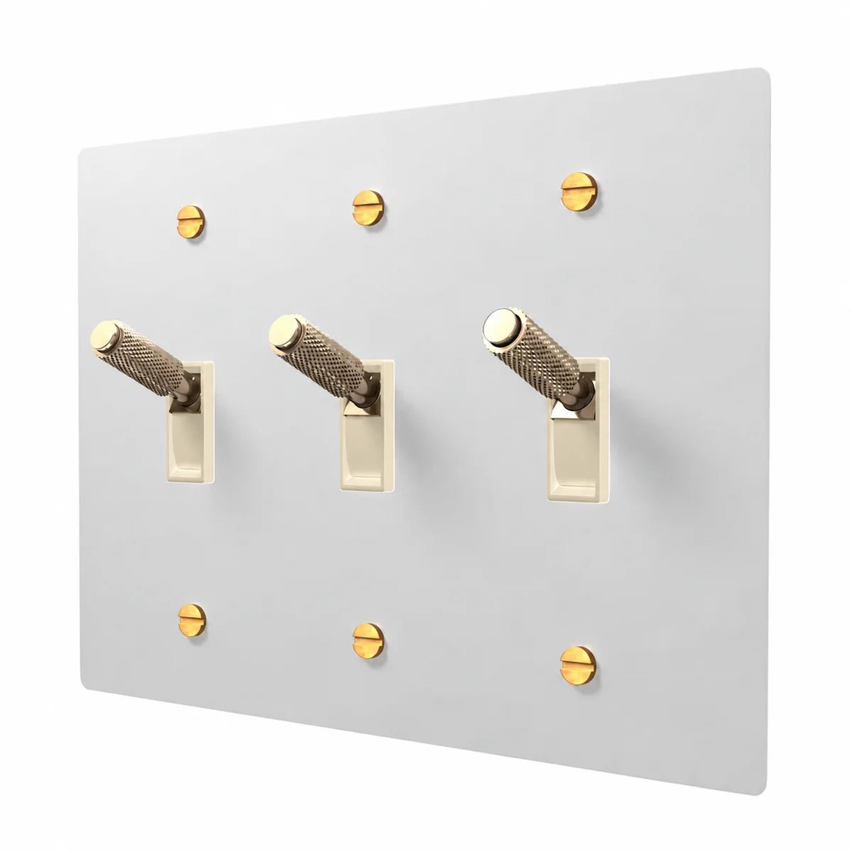 PlatePrestige Brass Toggle Switch 3-Gang in White / Brass with ivory toggle frames, angled view