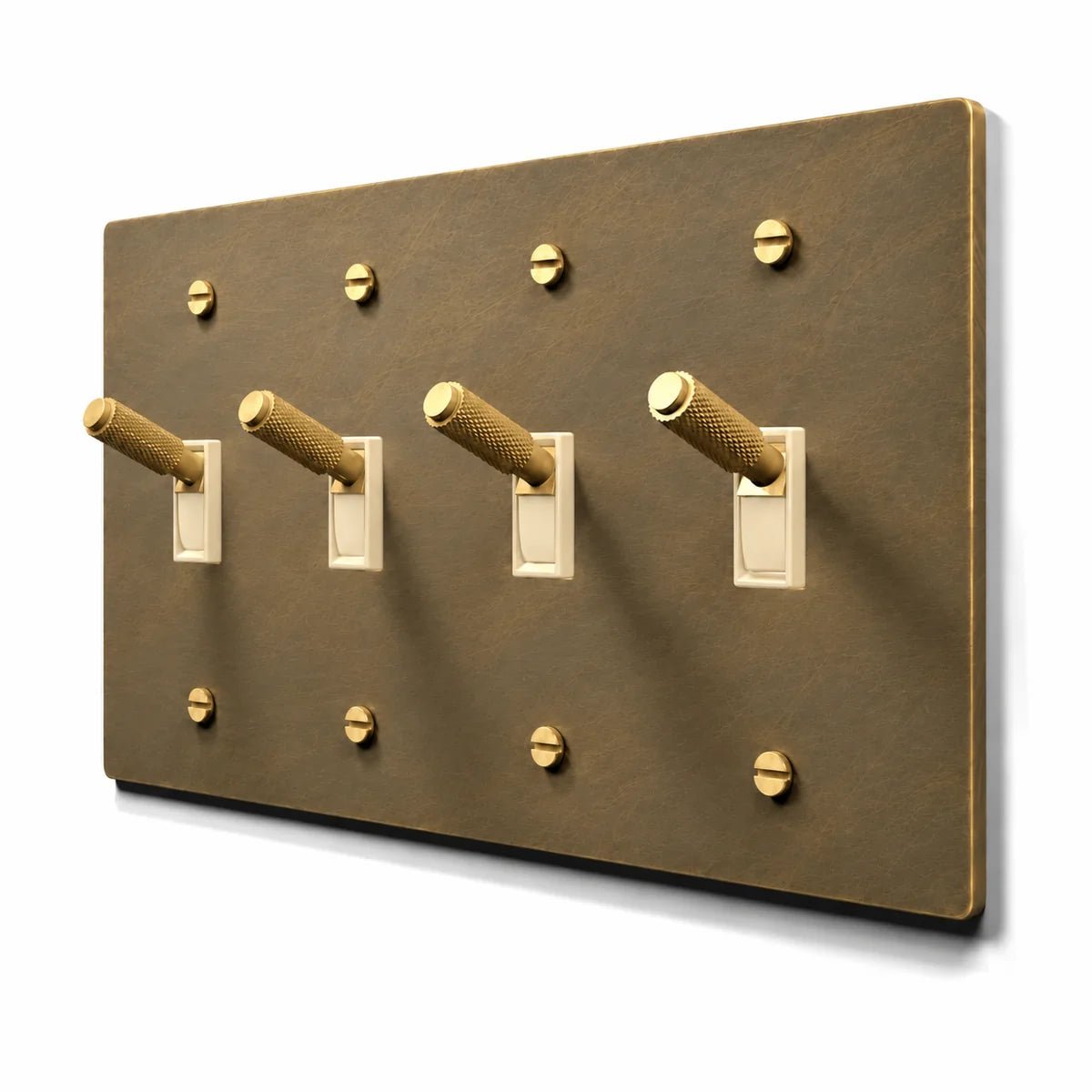 PlatePrestige Brass Toggle Switch 4-Gang in Aged Brass with ivory toggle frames, angled view
