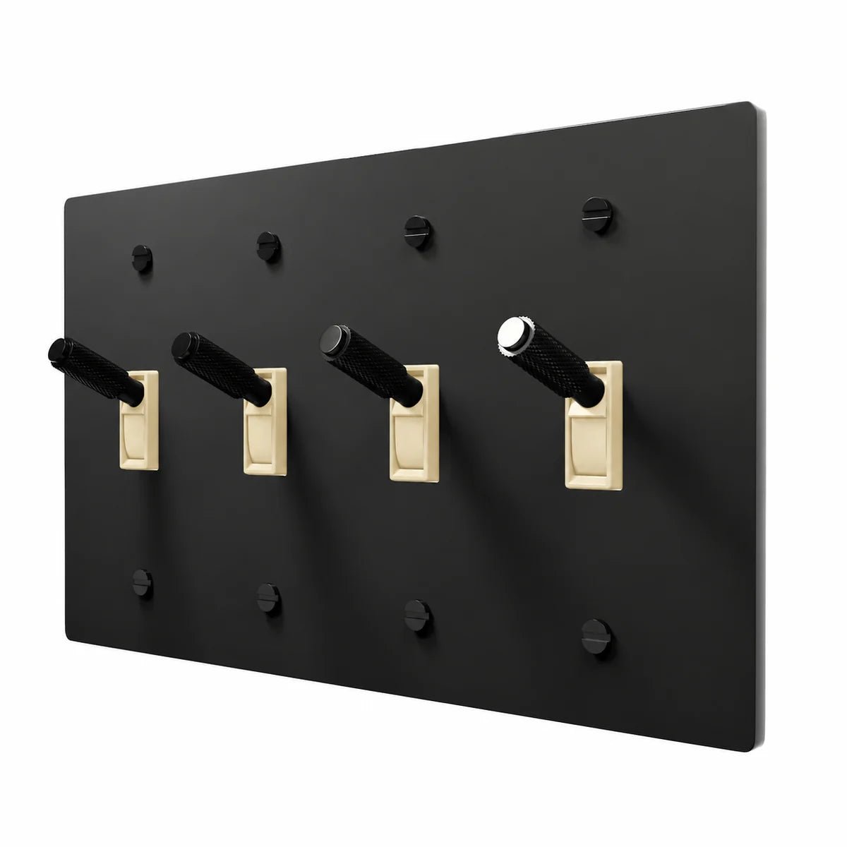 PlatePrestige Brass Toggle Switch 4-Gang in All‑Black with ivory toggle frames, angled view