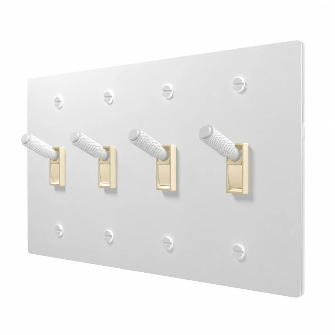 PlatePrestige Brass Toggle Switch 4-Gang in All-White with ivory toggle frames, angled view