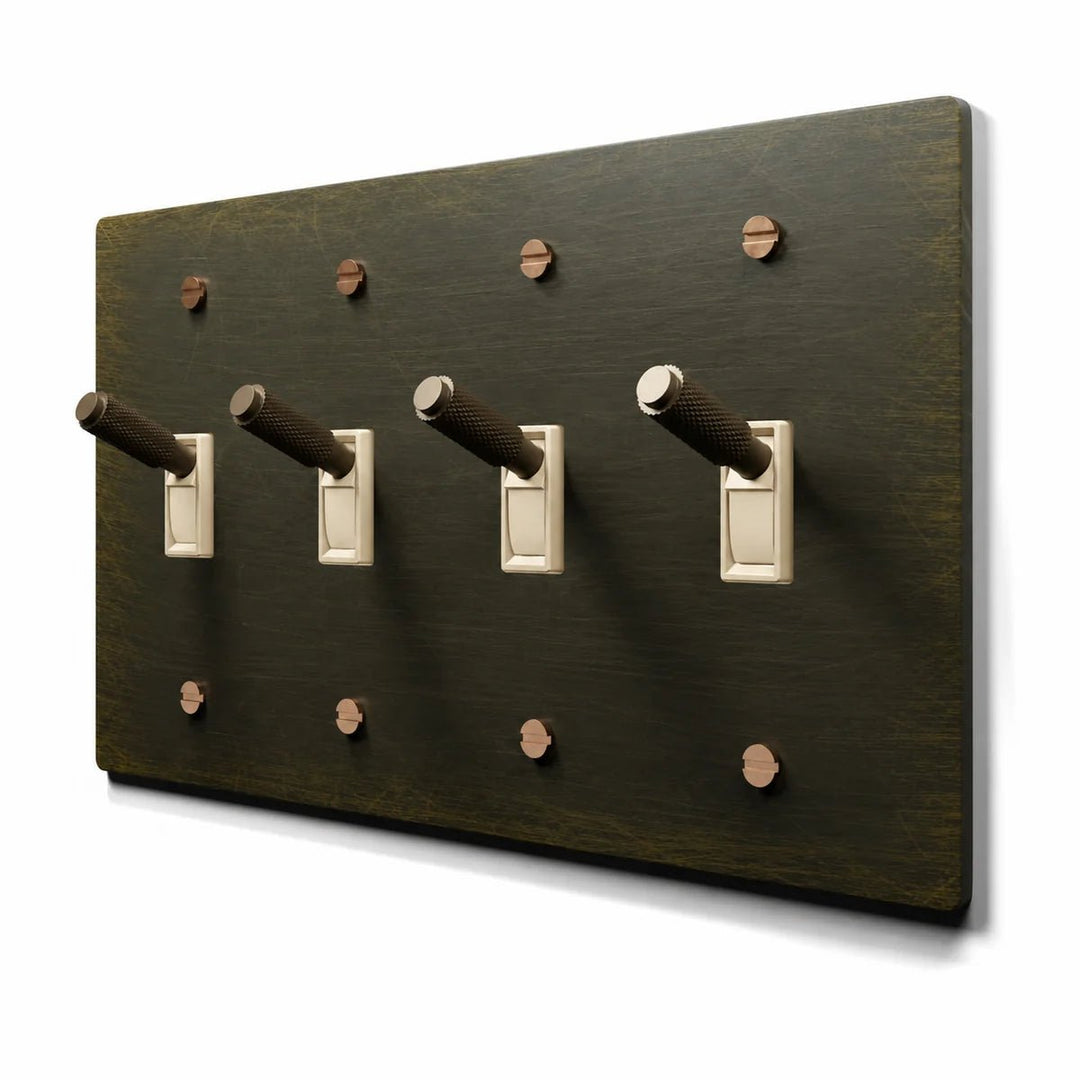 PlatePrestige Brass Toggle Switch 4-Gang in Antique Brass with ivory toggle frames, angled view