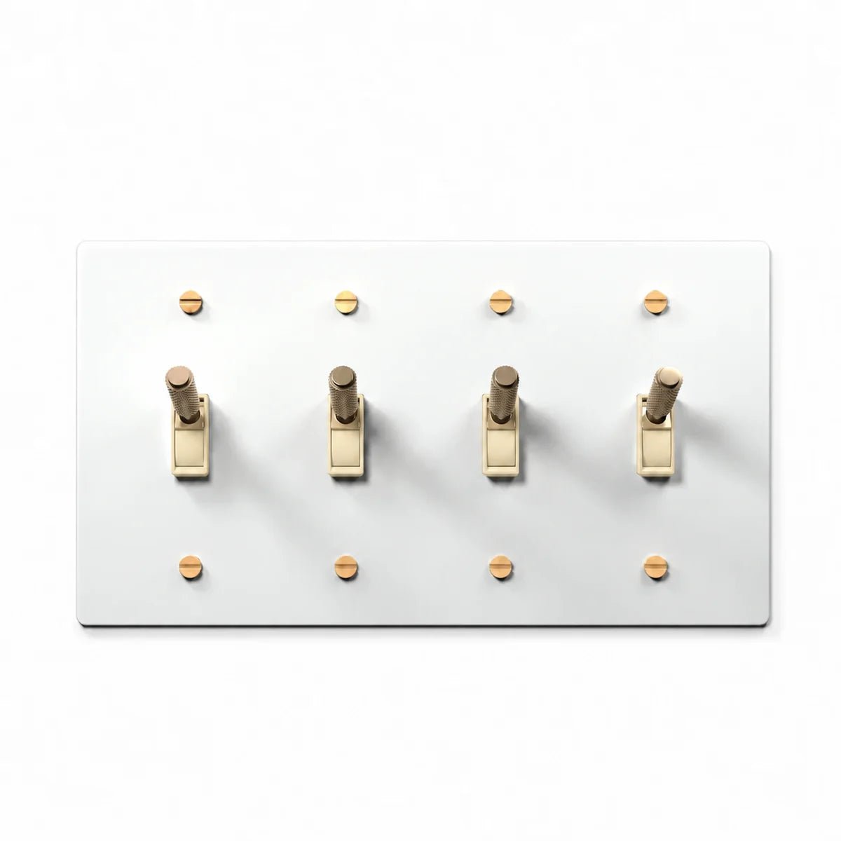PlatePrestige Brass Toggle Switch 4-Gang in White / Brass with ivory toggle frames, angled view