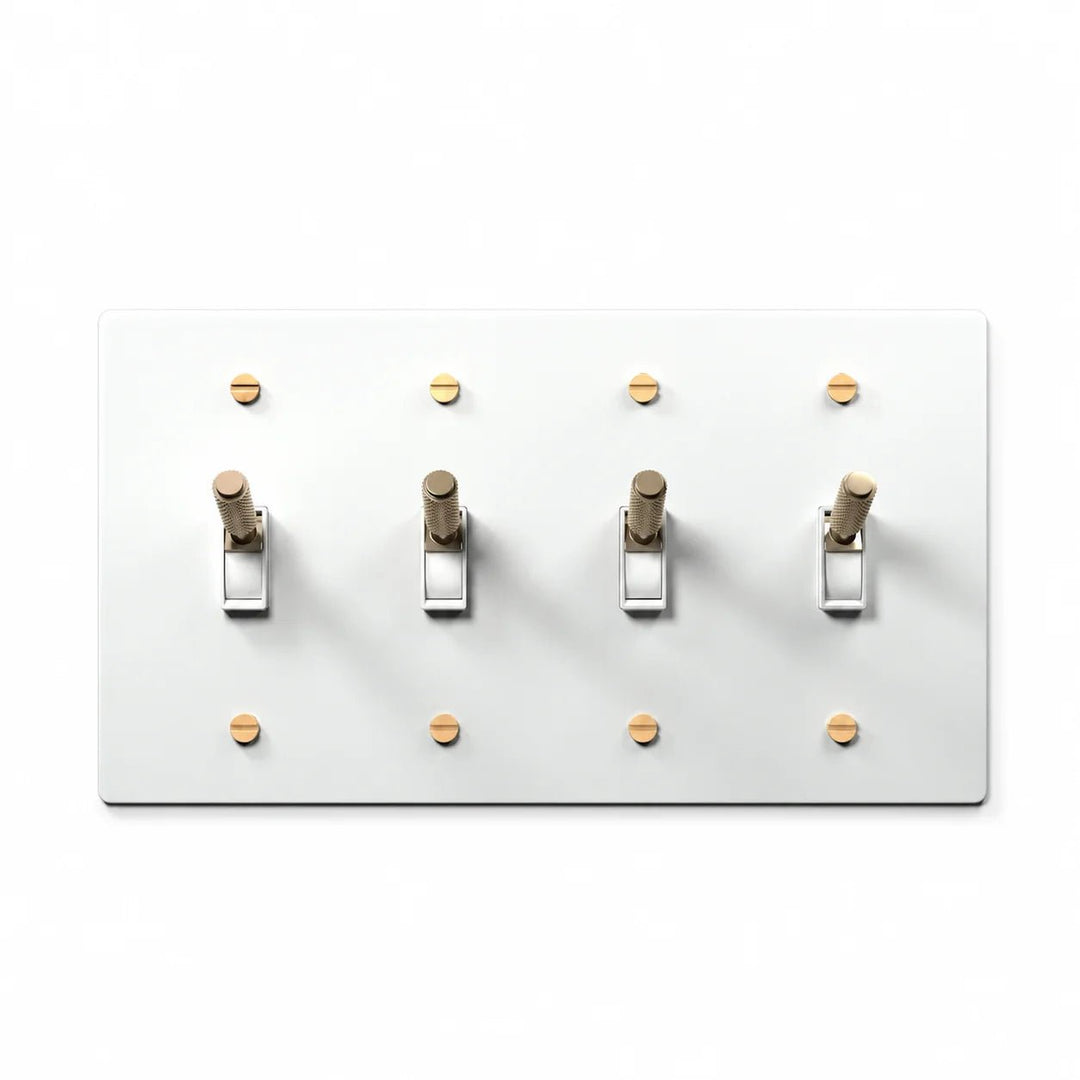 PlatePrestige 4-gang white and brass toggle light switch with matching brass screws