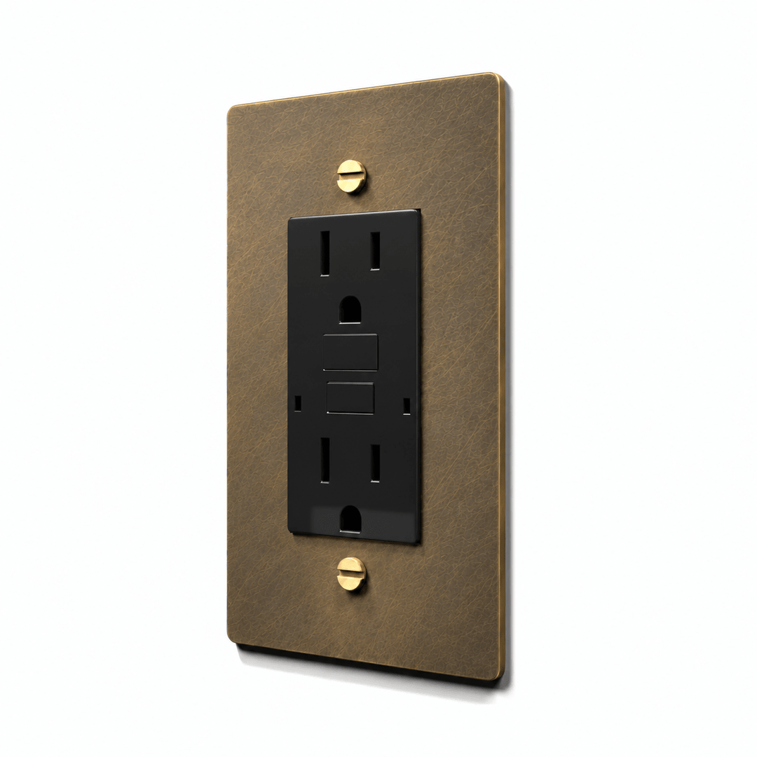 GFCI electrical outlet - aged brass wall plate