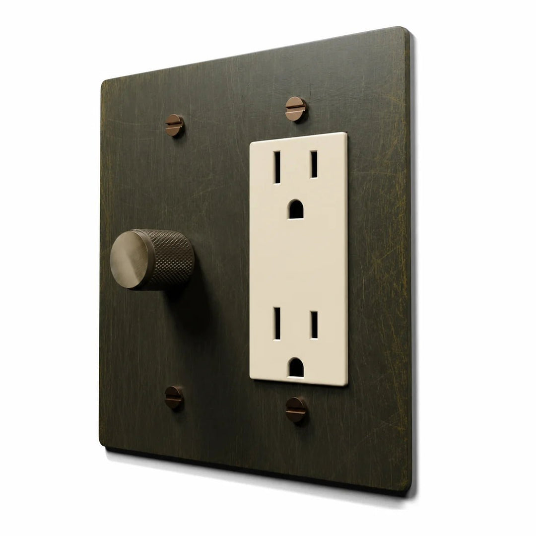 Brass Dimmer & Outlet Combo Switch Plate in Antique Brass with ivory outlet inserts, angled view