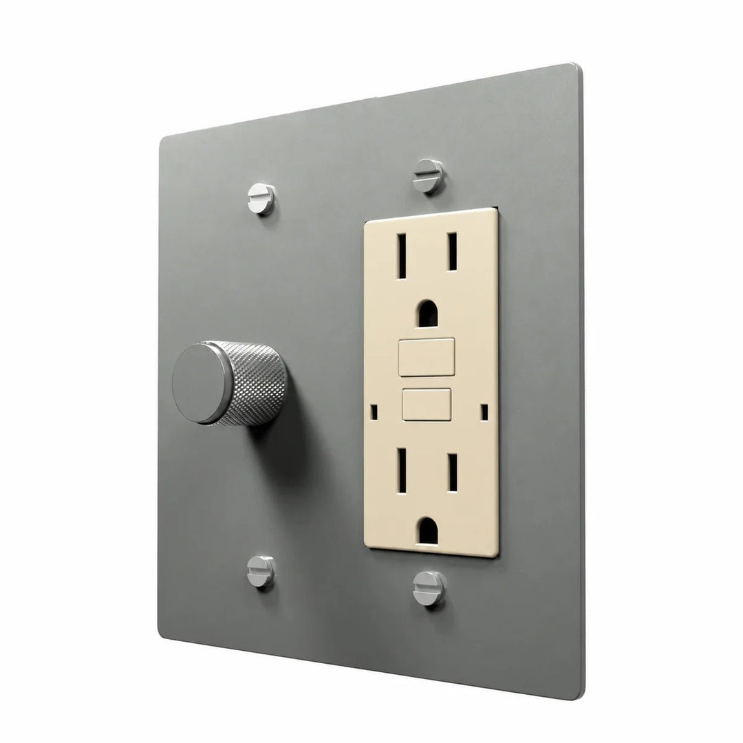 Brass Dimmer & Outlet Combo Switch Plate in Stainless Steel with ivory outlet inserts, angled view
