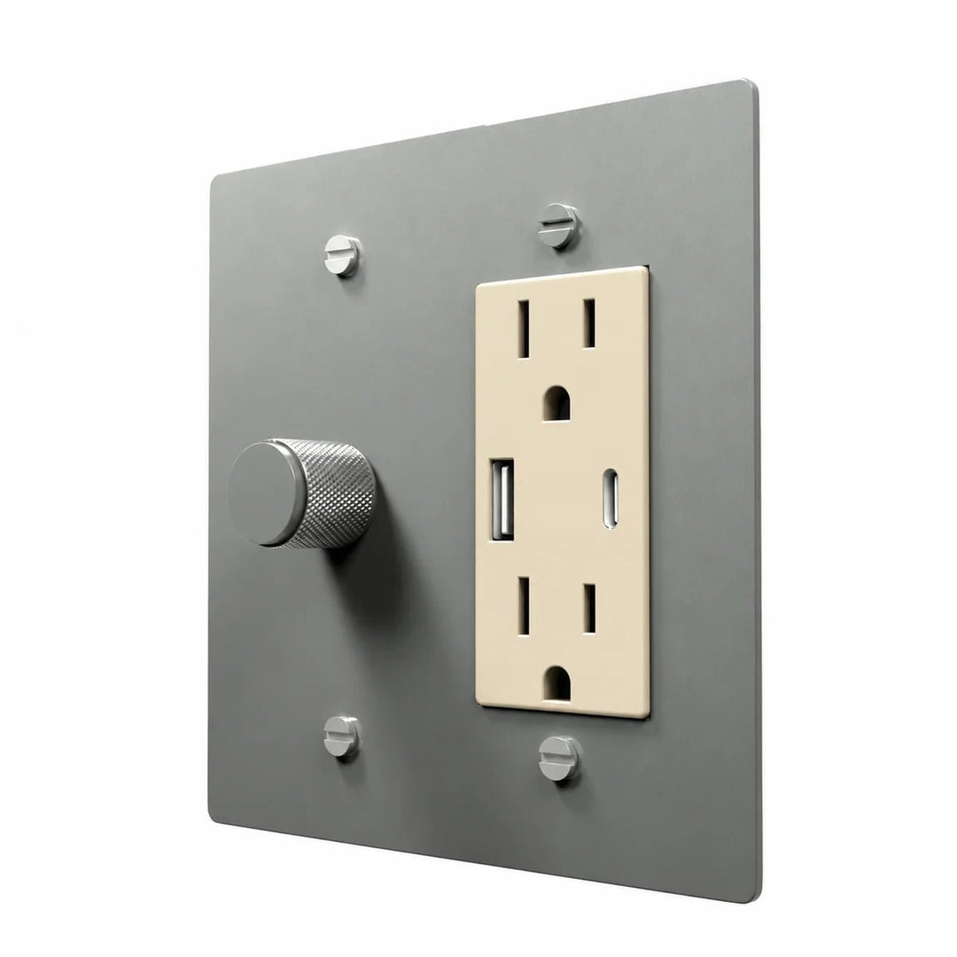 Brass Dimmer & Outlet Combo Switch Plate in Stainless Steel with ivory outlet inserts, angled view