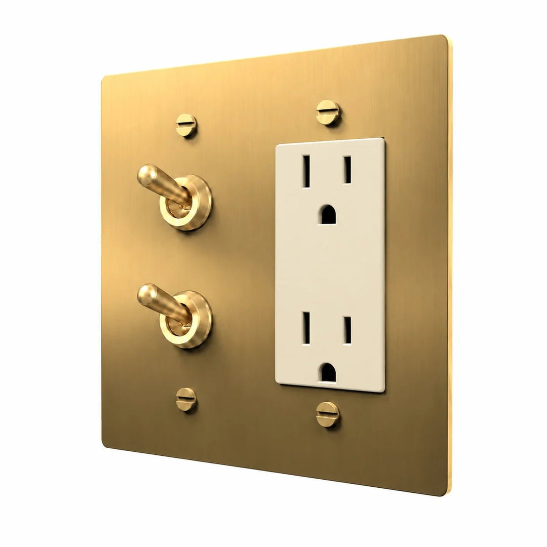 Brass Stacked Retro Toggle & Outlet Combo Switch Plate in Brass with ivory outlet inserts, angled view