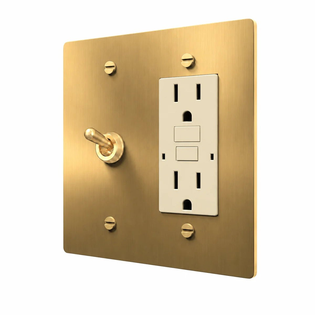 Brass Retro Toggle & Outlet Combo Switch Plate in Brass with ivory outlet inserts, angled view