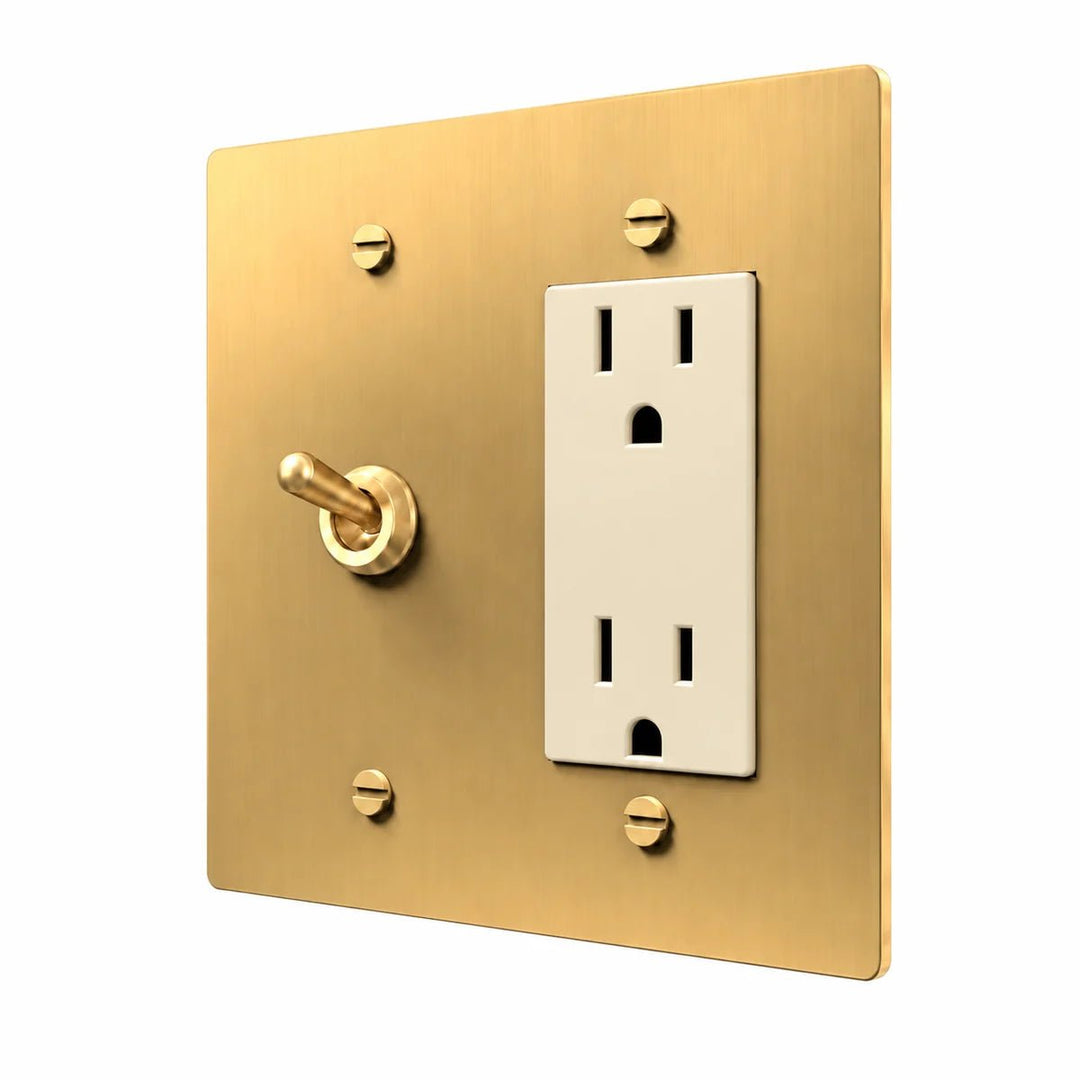 Brass Retro Toggle & Outlet Combo Switch Plate in Brass with ivory outlet inserts, angled view