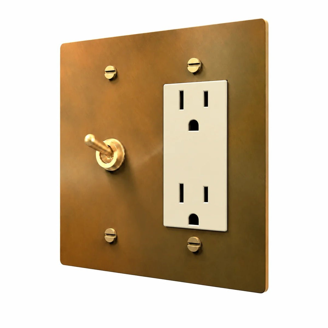 Brass Retro Toggle & Outlet Combo Switch Plate in Unlacquered Aged brass with ivory outlet inserts, angled view