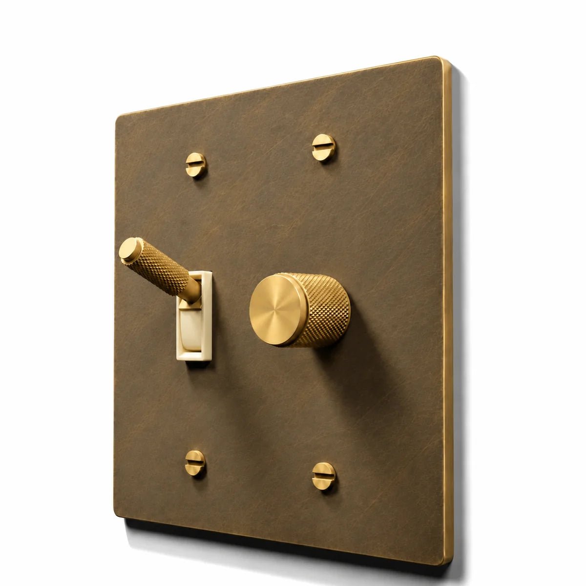 Brass Toggle & Dimmer Combo Switch Plate in Aged Brass with ivory toggle frames, angled view