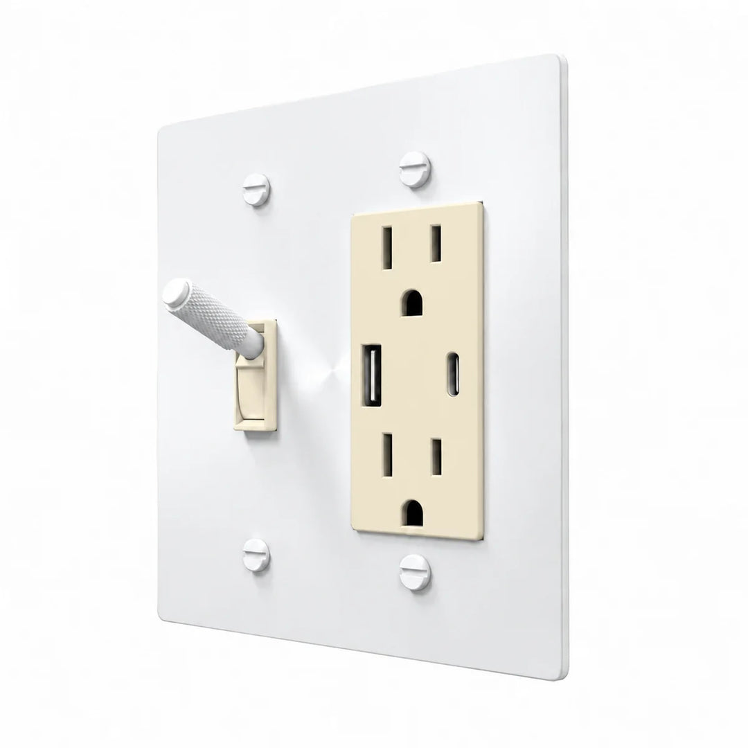 Brass Toggle & Outlet Combo Switch Plate in All-White with ivory toggle frames and outlet inserts, angled view