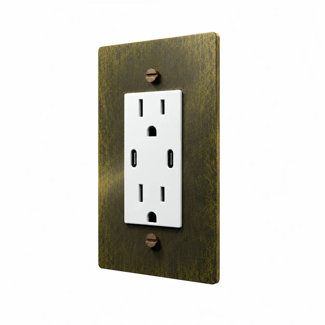 Angle view of PlatePrestige dual USB-C electrical outlet, antique brass wall plate with white receptacle and coordinated screws