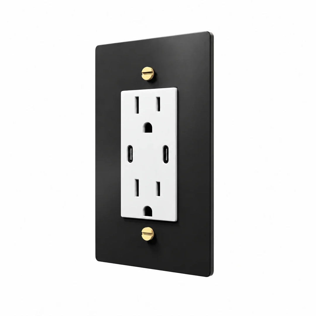 Angle view of PlatePrestige dual USB-C electrical outlet, black / brass wall plate with white receptacle and coordinated screws