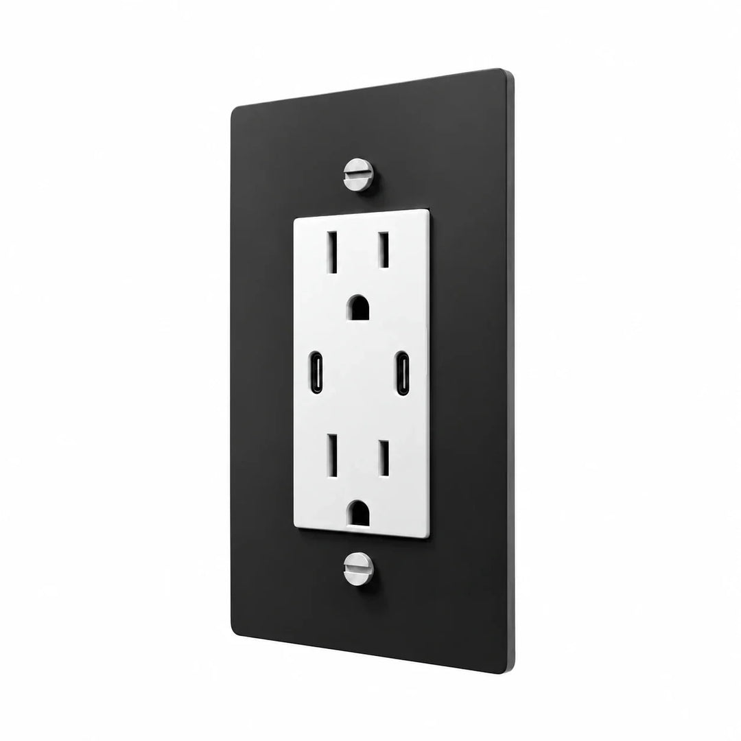Angle view of PlatePrestige dual USB-C electrical outlet, black / stainless wall plate with white receptacle and coordinated screws