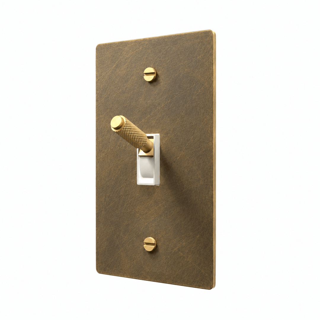 Aged brass light switch with knurled toggle