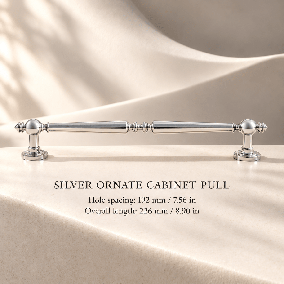 Polished silver ornate cabinet pull, 192 mm hole spacing, individual millimeter and inch dimensions on ivory stone