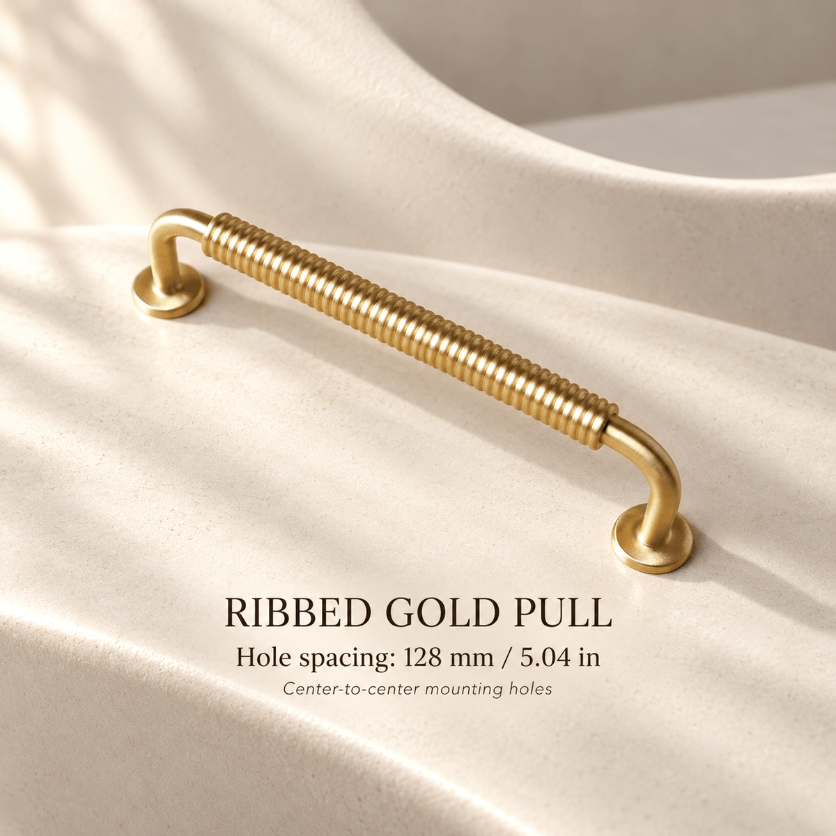 Gold ribbed cabinet pull with round bases — 128 mm / 5.04 in hole spacing