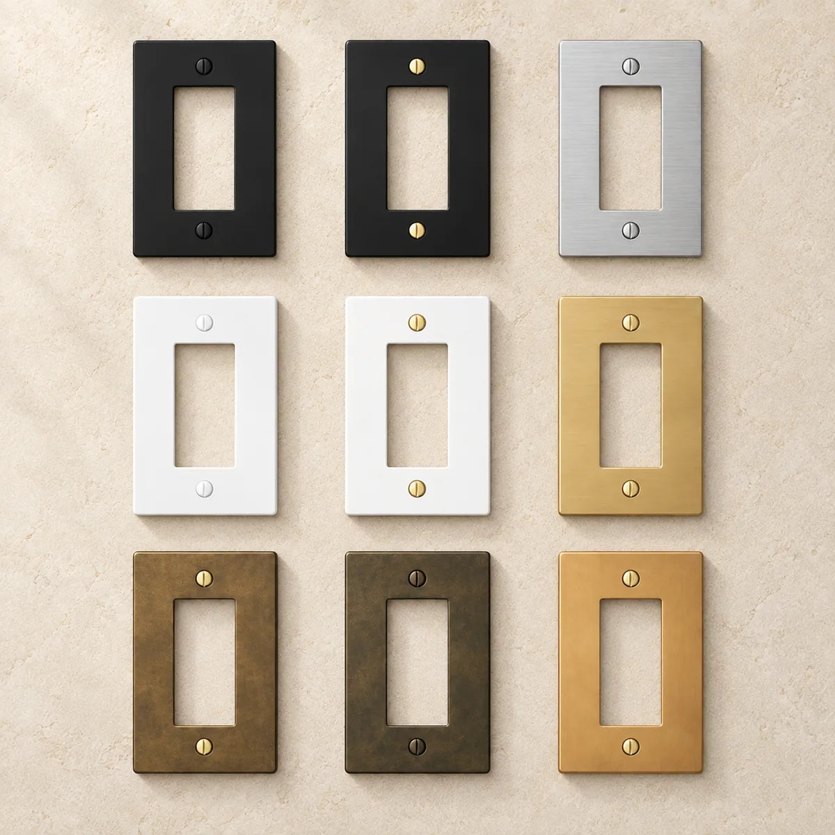 Nine PlatePrestige wall plate finish options showing matching and contrasting screw colors, arranged on warm ivory stone.