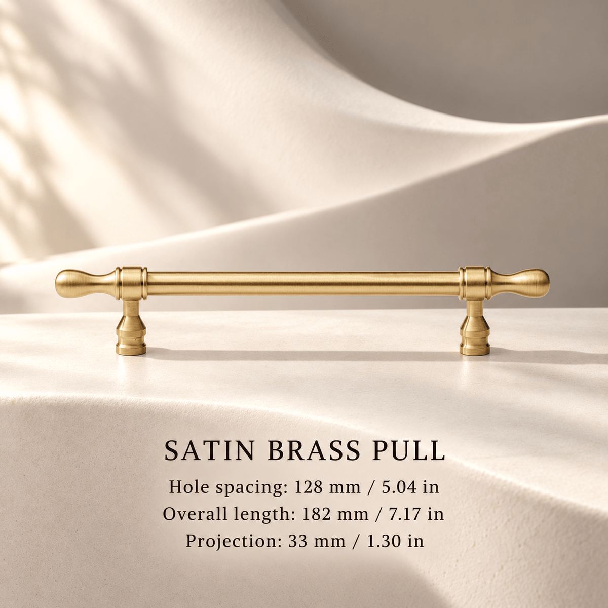 Satin brass cabinet pull with flared tips — Hole spacing: 128 mm / 5.04 in; Overall length: 182 mm / 7.17 in; Projection: 33 mm / 1.30 in