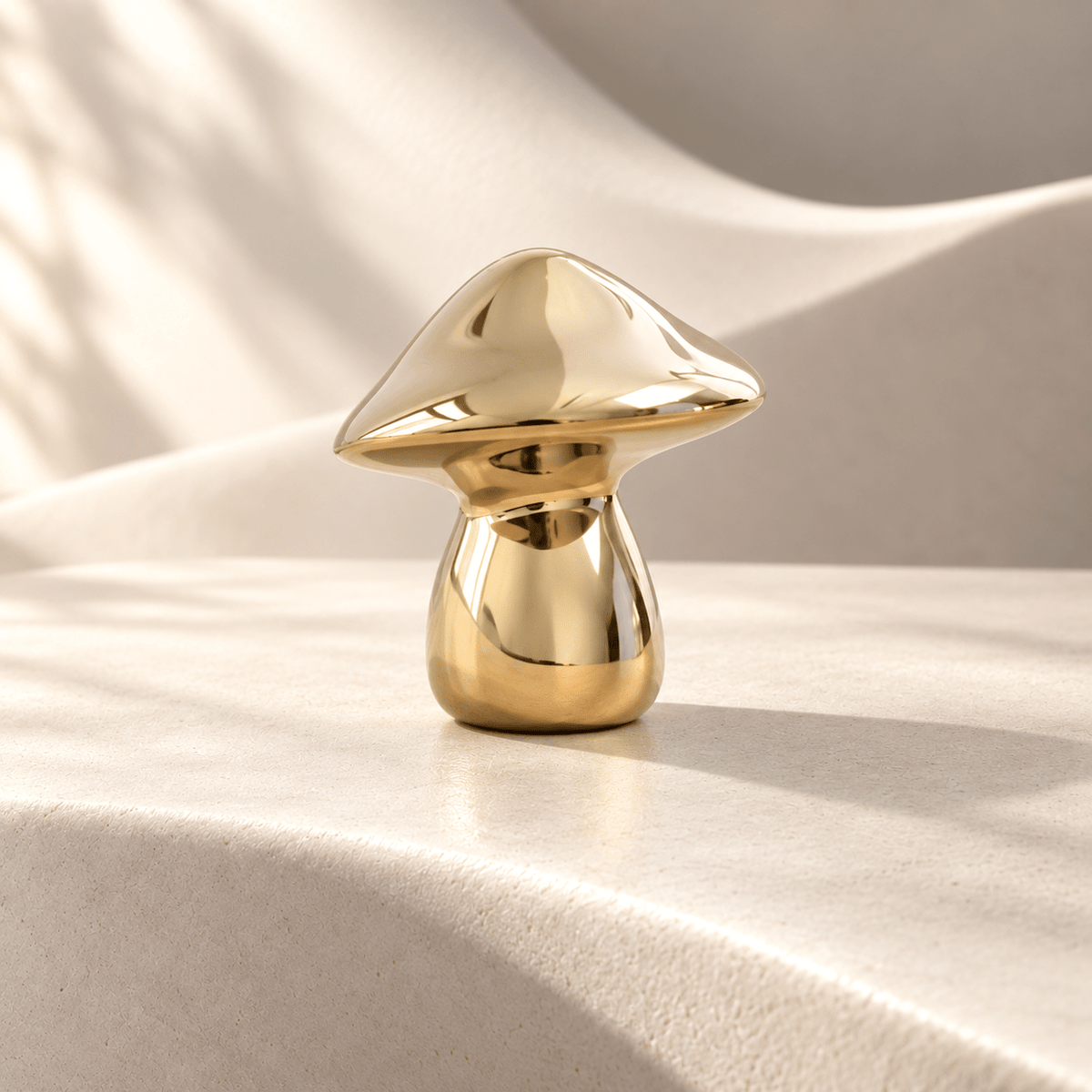 Sculptural gold mushroom cabinet knob, 25 mm head width — Ivory Atelier studio photograph