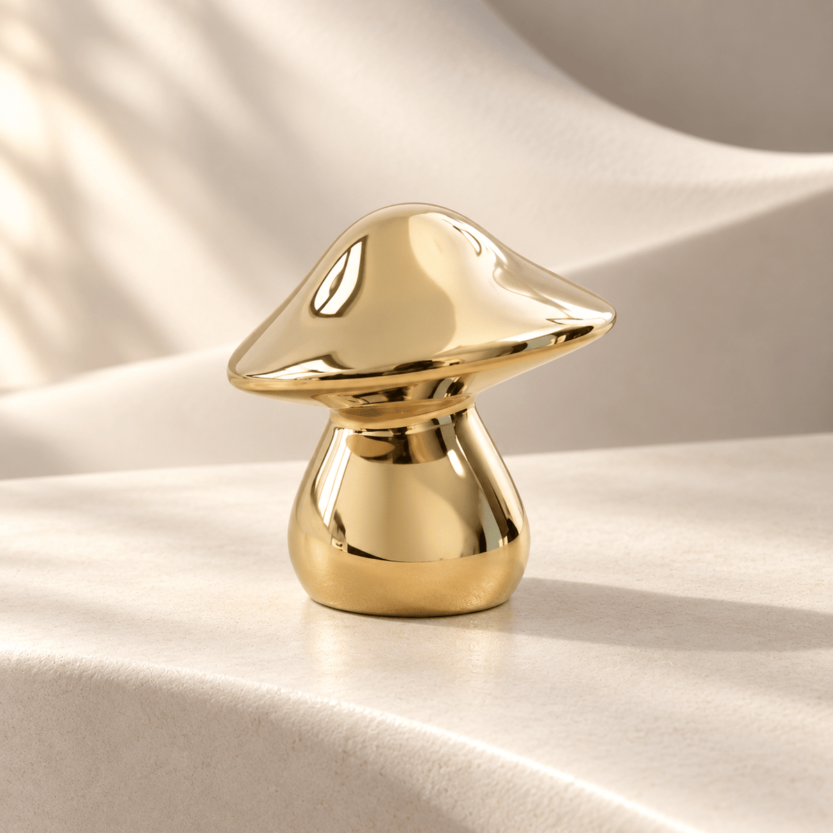 Sculptural gold mushroom cabinet knob, 30 mm head width — Ivory Atelier studio photograph