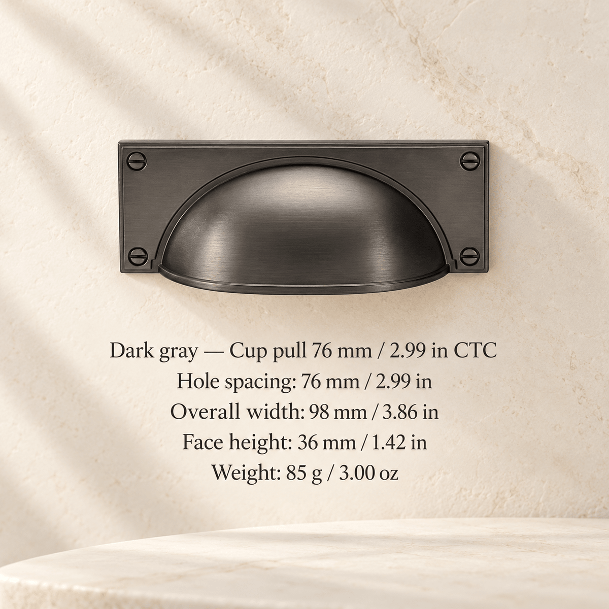 Square-base cabinet hardware — Dark gray — Cup pull 76 mm / 2.99 in CTC; Hole spacing: 76 mm / 2.99 in; Overall width: 98 mm / 3.86 in; Face height: 36 mm / 1.42 in; Weight: 85 g / 3.00 oz — ivory stone studio