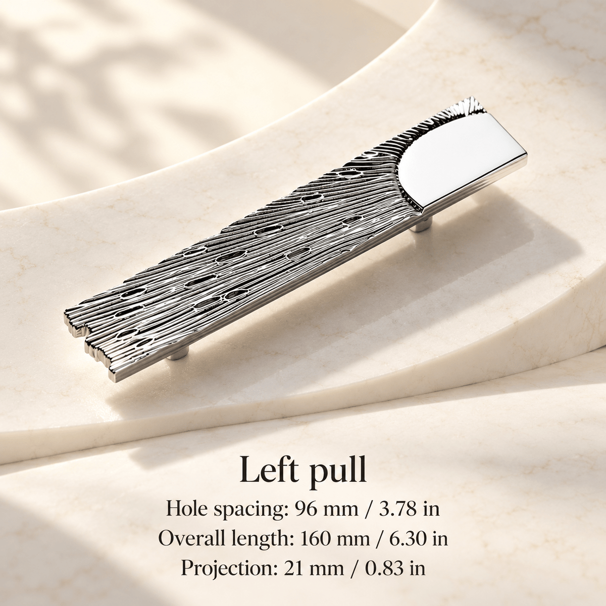 Silver textured plate cabinet left pull in ivory studio. Hole spacing: 96 mm / 3.78 in; Overall length: 160 mm / 6.30 in; Projection: 21 mm / 0.83 in