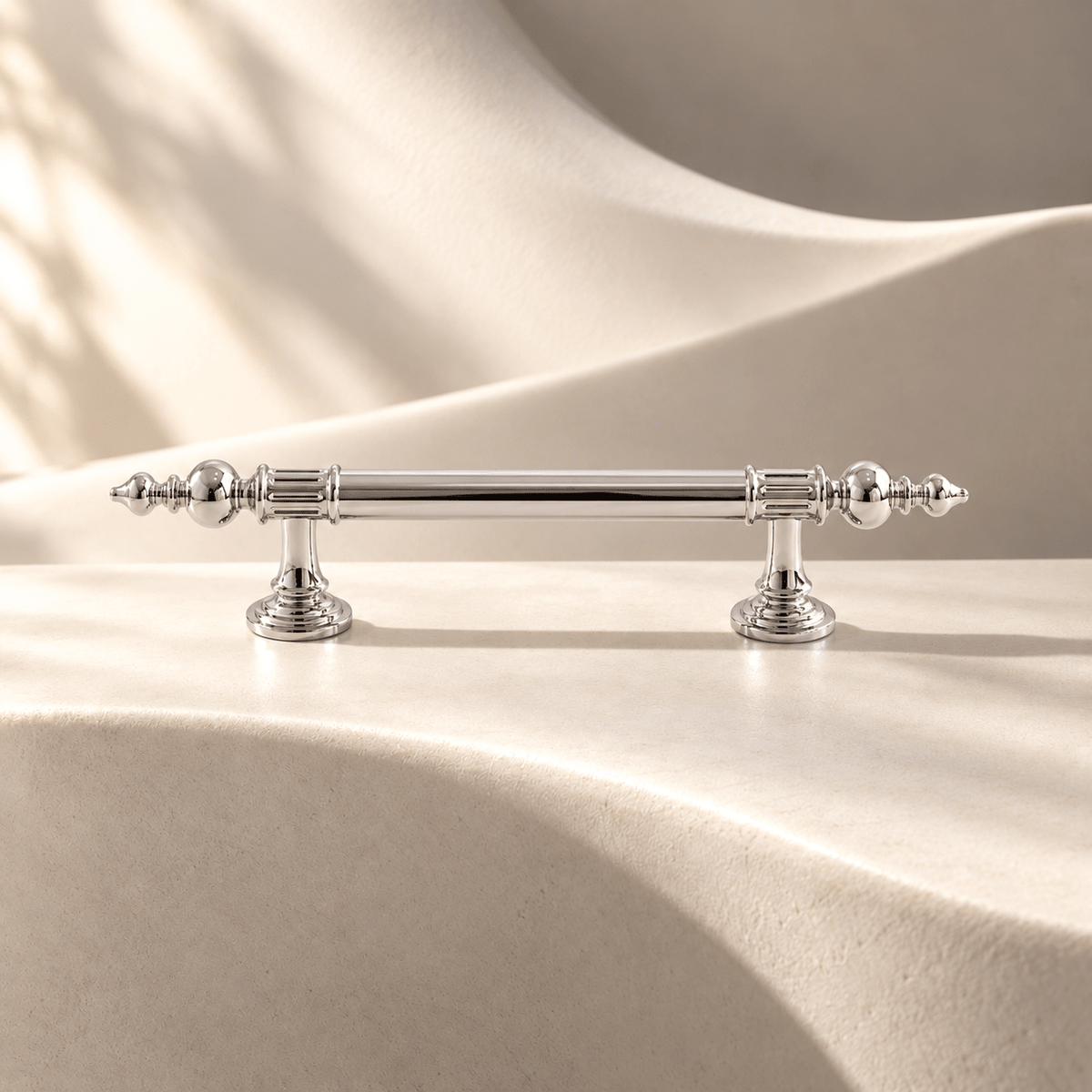 Bright silver 96 mm CTC finial cabinet pull on warm ivory stone
