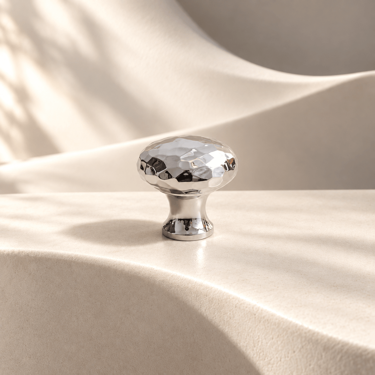 Silver hammered cabinet knob 24 mm diameter on warm ivory stone