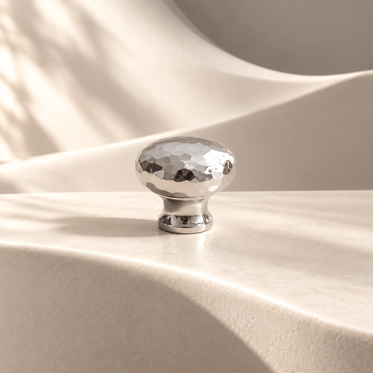 Silver hammered cabinet knob 27 mm diameter on warm ivory stone