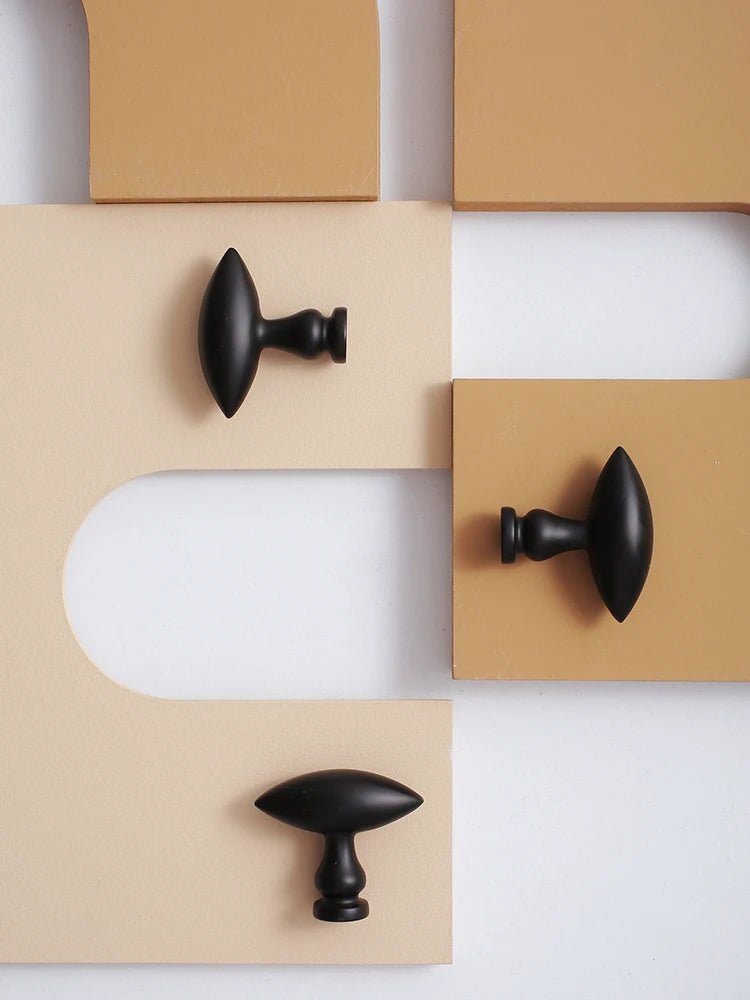 Stylish Matte Black Brass Knobs with Gold Accents for Cabinets