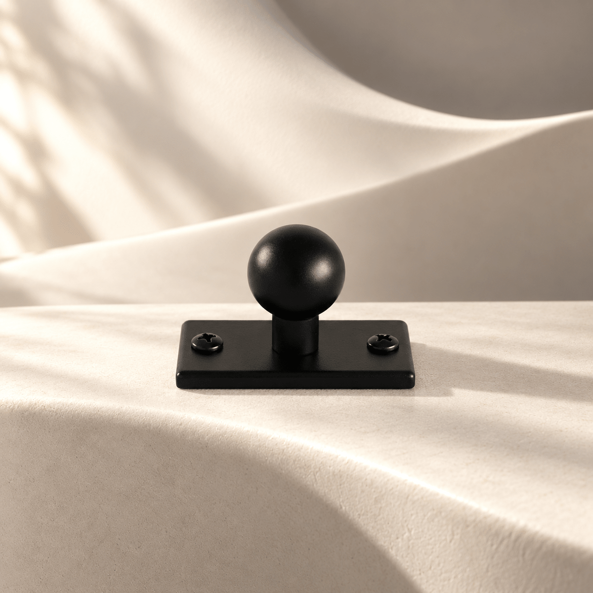 Black 50 mm backplate sphere knob on ivory stone