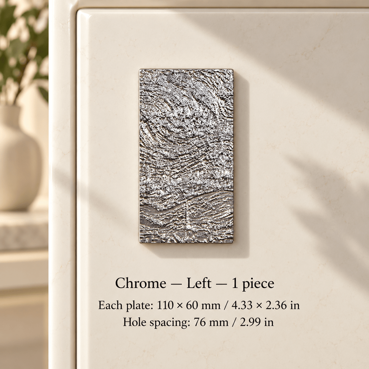 Textured chrome rectangular plate pull Chrome — left, 1 piece; Chrome — Left — 1 piece; Each plate: 110 × 60 mm / 4.33 × 2.36 in; Hole spacing: 76 mm / 2.99 in on ivory studio background