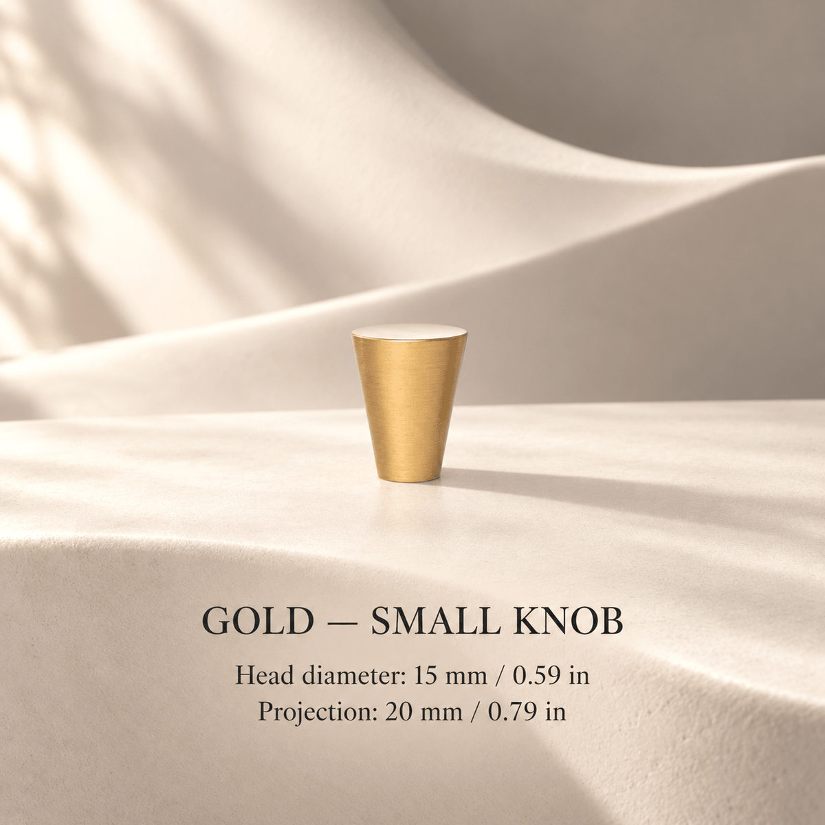 Small tapered gold cabinet knob in ivory studio. Head diameter: 15 mm / 0.59 in; Projection: 20 mm / 0.79 in