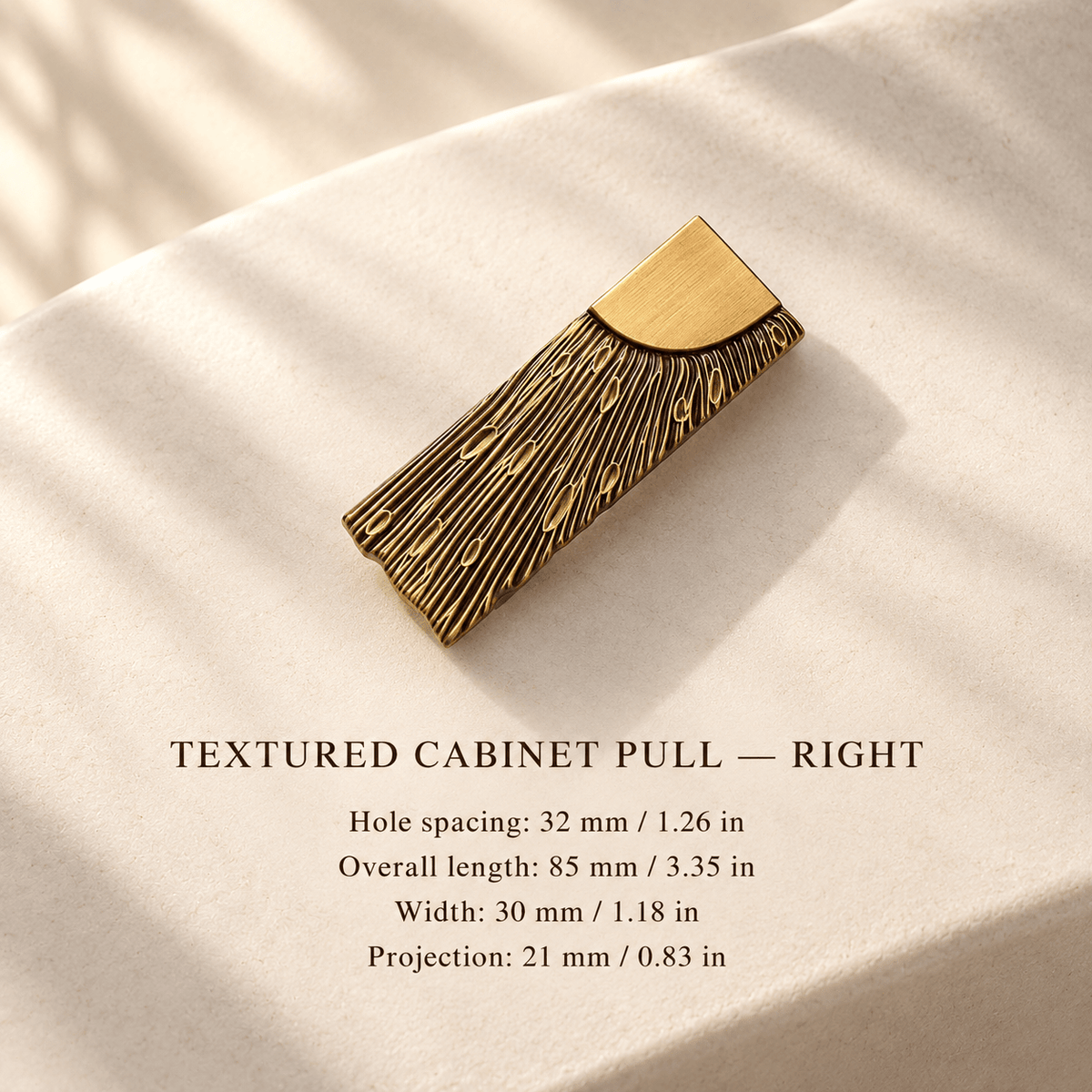 Right-facing textured antique bronze cabinet pull, 32 mm hole spacing, individual millimeter and inch measurements in an ivory studio