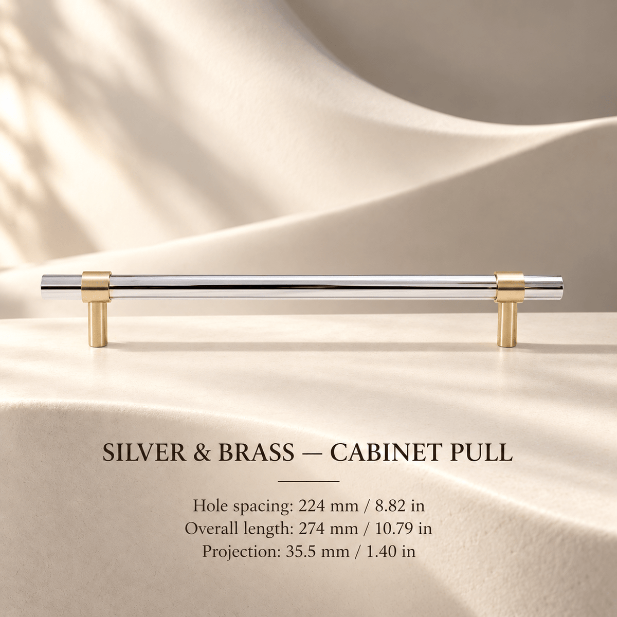 Silver steel and brass cabinet pull in ivory studio. Hole spacing: 224 mm / 8.82 in; Overall length: 274 mm / 10.79 in; Projection: 35.5 mm / 1.40 in