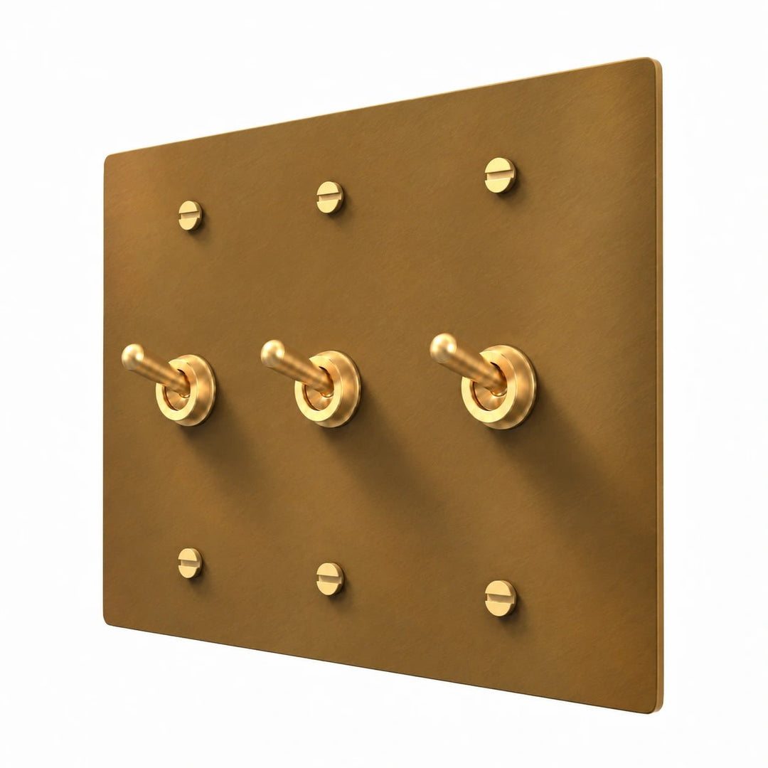 3 gang unlacquered aged brass switch plate with retro toggle
