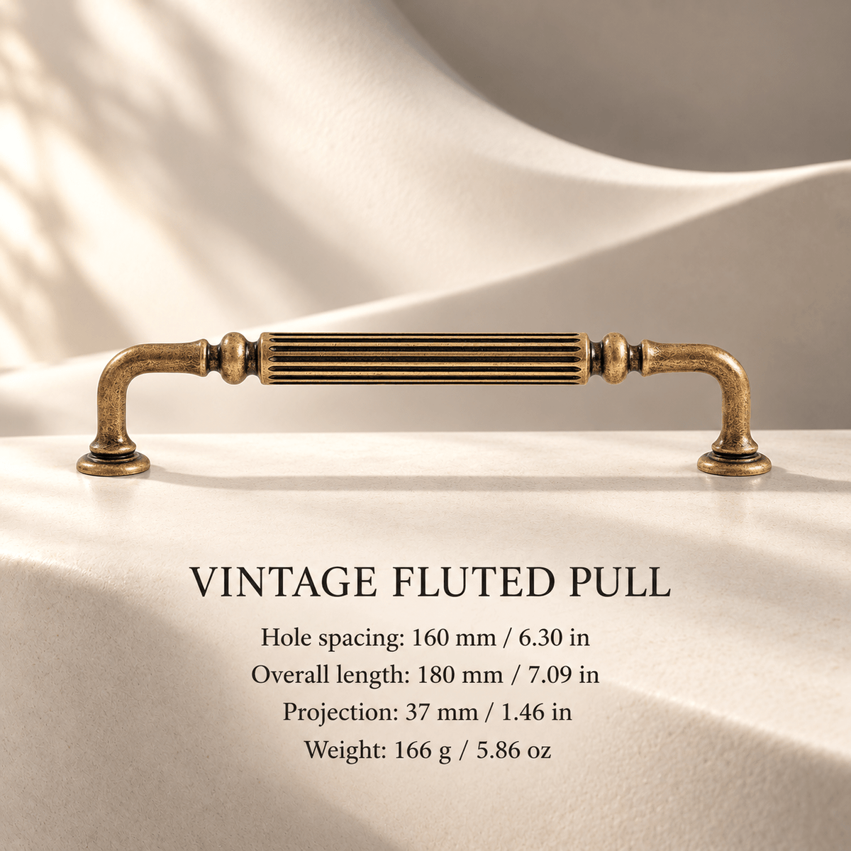 Vintage antique bronze fluted arched cabinet pull in ivory studio. Hole spacing: 160 mm / 6.30 in; Overall length: 180 mm / 7.09 in; Projection: 37 mm / 1.46 in; Weight: 166 g / 5.86 oz.