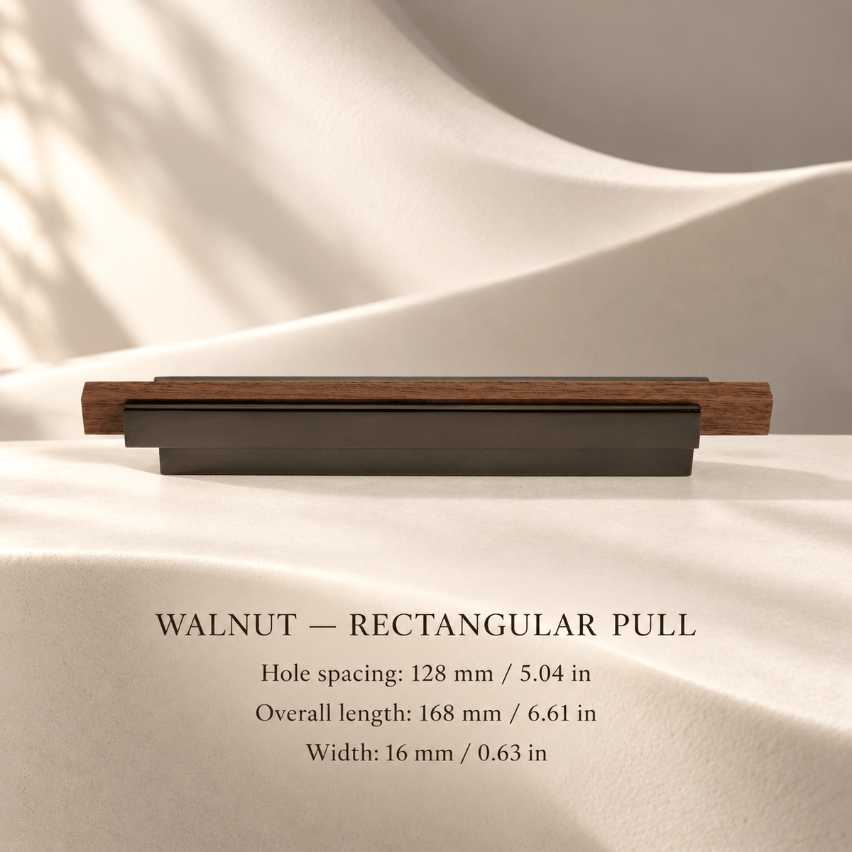 Walnut rectangular cabinet pull in ivory studio. Hole spacing: 128 mm / 5.04 in; Overall length: 168 mm / 6.61 in; Width: 16 mm / 0.63 in