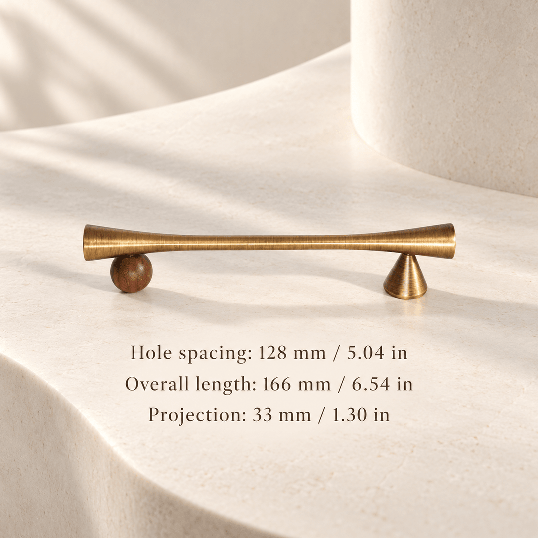 Antique bronze cabinet pull with wooden sphere and cone supports in ivory studio. Hole spacing: 128 mm / 5.04 in; Overall length: 166 mm / 6.54 in; Projection: 33 mm / 1.30 in