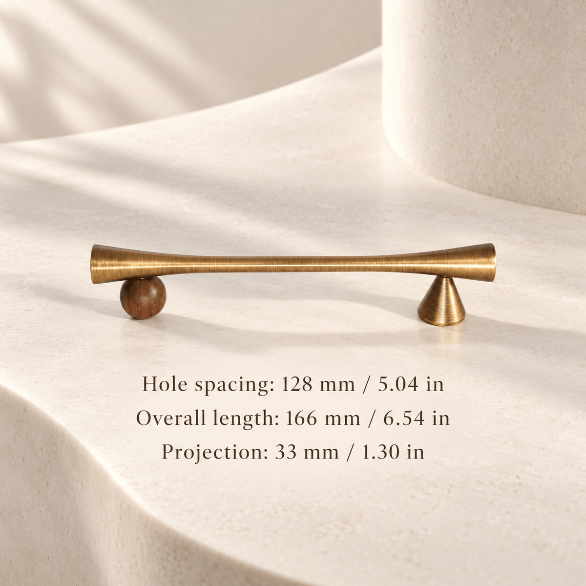 Antique bronze cabinet pull with wooden sphere and cone supports in ivory studio. Hole spacing: 128 mm / 5.04 in; Overall length: 166 mm / 6.54 in; Projection: 33 mm / 1.30 in