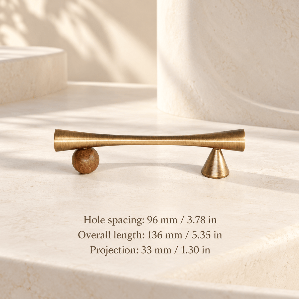 Antique bronze cabinet pull with wooden sphere and cone supports in ivory studio. Hole spacing: 96 mm / 3.78 in; Overall length: 136 mm / 5.35 in; Projection: 33 mm / 1.30 in
