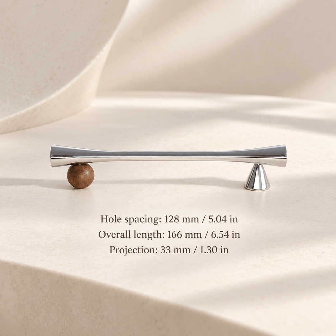 Silver cabinet pull with wooden sphere and cone supports in ivory studio. Hole spacing: 128 mm / 5.04 in; Overall length: 166 mm / 6.54 in; Projection: 33 mm / 1.30 in